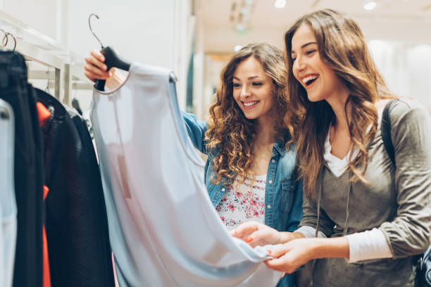 Two young women in the fashion store Two young women in the fashion store